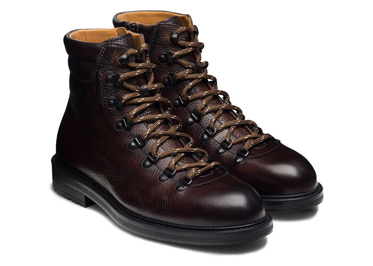 Featured in the 2024 Holiday Gift Guide by duPont REGISTRY, this pair of dark brown leather hiking boots boasts detailed lacing, black soles, and a smooth finish. Perfect for outdoor enthusiasts seeking both style and durability.