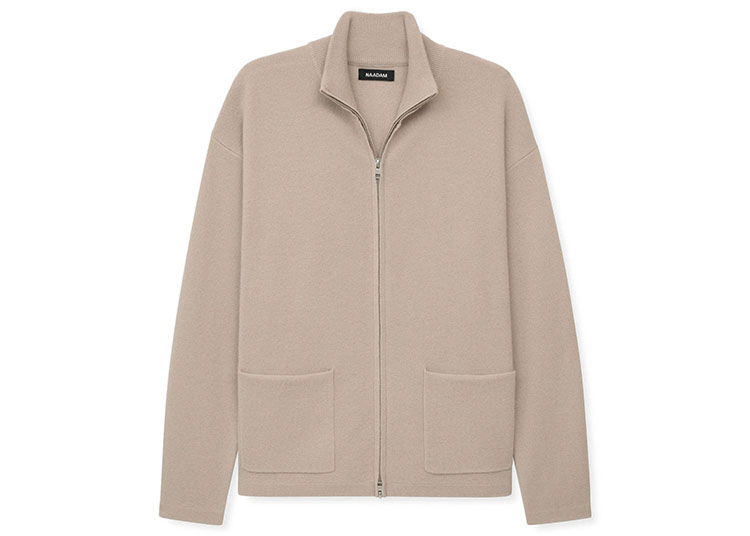 A beige zip-up jacket with a high collar and two front pockets, perfect for gentlemen seeking luxurious style, displayed on a white background.