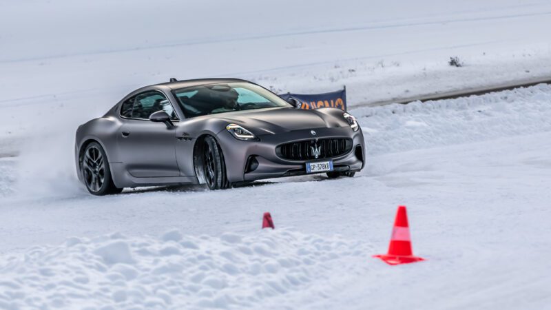 An image of a Maserati GranTurismo Folgore driving on an ice track.