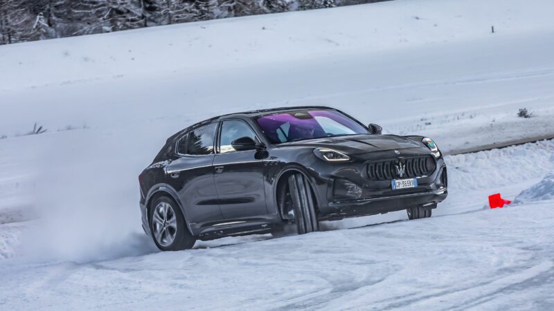 An image of a Maserati Grecale Folgore driving on an ice track.