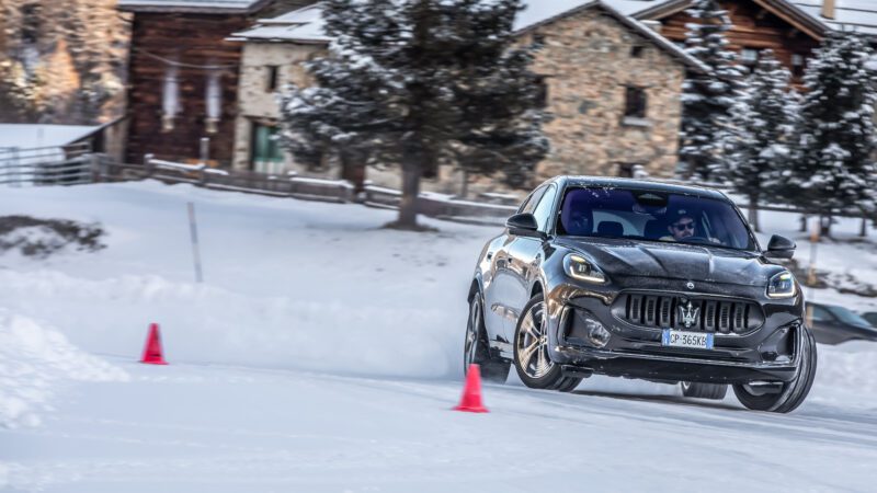 An image of a Maserati Grecale Folgore driving on an ice track.