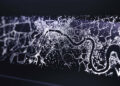 A record-breaking abstract digital map showcases a network of glowing white dots and lines on a dark background, reminiscent of bespoke commissions by Rolls-Royce.