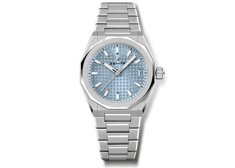 A silver Zenith wristwatch with a light blue textured dial, date display, and metal link band, as featured in the 2024 duPont REGISTRY Holiday Gift Guide.