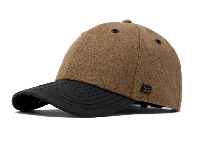 This brown baseball cap, featuring a black leather brim and a small emblem on the side, is a perfect choice for gentlemen who appreciate subtle elegance. Ideal as luxury gifts, it blends style with sophistication seamlessly.