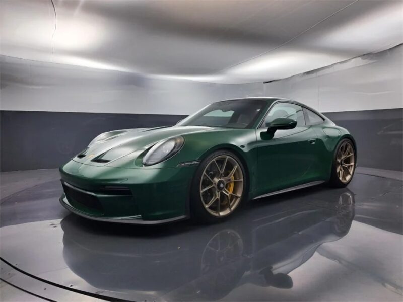 An exotic green sports car with gold rims gleams in the showroom, flaunting its allure. This luxury car, an epitome of sophistication and speed, is now available for sale to those with a taste for the extraordinary.