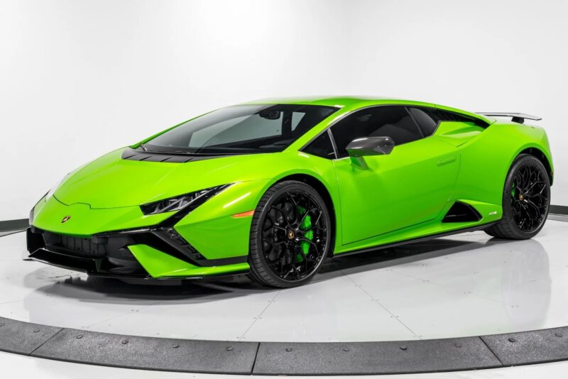 Experience the allure of this exotic sports car in vibrant green, complete with black accents and a sleek, low profile. Displayed on a rotating platform in a pristine white studio, this luxury car captures attention effortlessly.