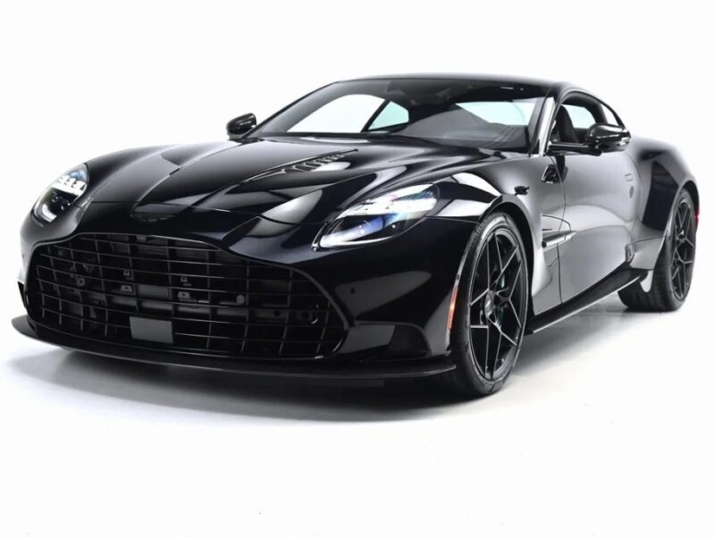 A black luxury sports car with a sleek design and glossy finish is shown from a front angle on a white background, epitomizing the allure of exotic cars often featured in high-end for sale listings.