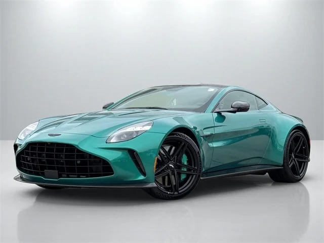 A turquoise exotic car with black wheels and a sleek design is parked indoors on a white floor, showcasing its allure as a luxury car.