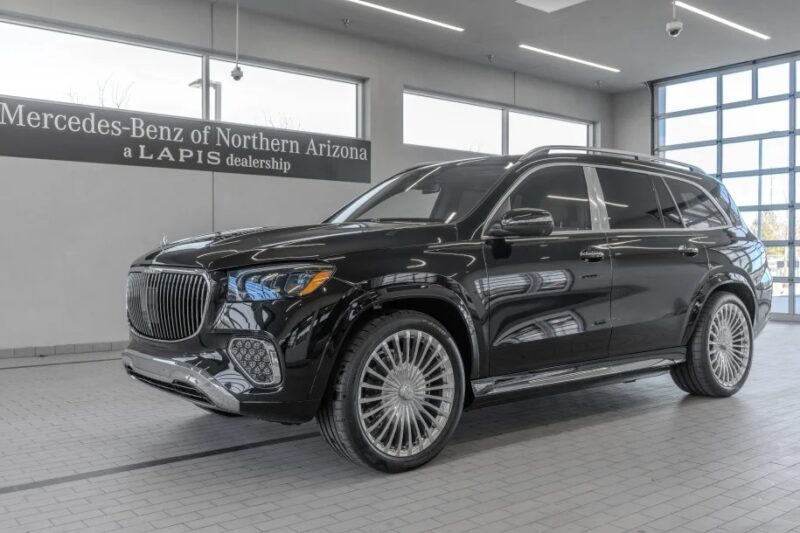 A black luxury SUV is showcased in a showroom, labeled "Mercedes-Benz of Northern Arizona, a Lapis dealership." This exquisite vehicle is an exotic car gem within their exclusive for sale listings.