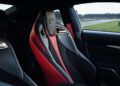 Interior view of the 2025 RC F Final Edition showcases black and red leather sports seats with intricate stitching details and metallic accents, embodying the luxurious craftsmanship synonymous with Lexus design.