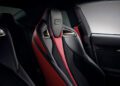 Close-up of a black and red sports car seat with a sleek design, set inside the dark interior of the exclusive 2025 RC F Final Edition.