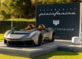 Sleek, gray sports car displayed on a platform against a backdrop featuring the "Automobili Pininfarina" and "F1TERPRISES" logos, heralding a groundbreaking 2024 innovation.