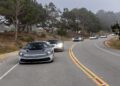 A groundbreaking 2024 automobili Pininfarina leads a line of sports cars along the curved, tree-lined road on a foggy day.