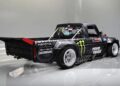 The customized black Ford F-150 Hoonitruck boasts 917HP under the hood, featuring large tires and displaying sponsor logos like Monster Energy, Toyo Tires, and Hoonigan on its rugged body.