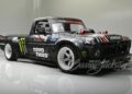 A custom black Ford F-150, known as the Hoonitruck, boasts 917HP with Ford branding and Toyo Tires logo. It features wide tires, a low body stance, and eye-catching decals, including Monster Energy logos.