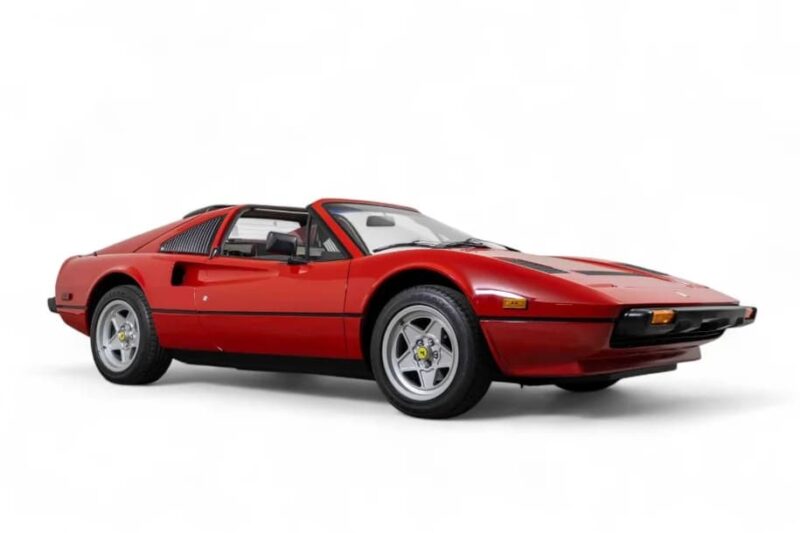 A red, classic sports car with a sleek, low profile and Targa top, shown on a plain white background—an ideal choice for enthusiasts seeking one of the best manual transmission cars.
