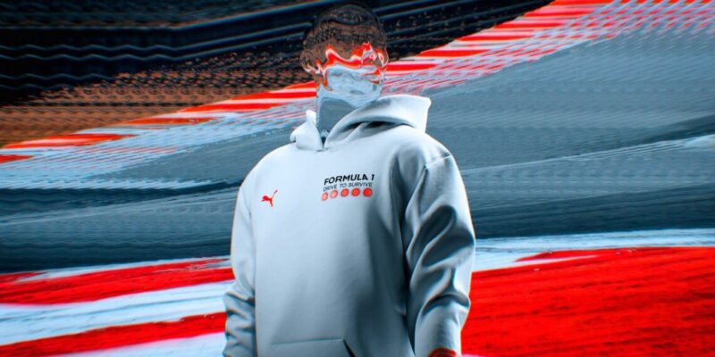 In a distorted image, a person dons a white hoodie emblazoned with 