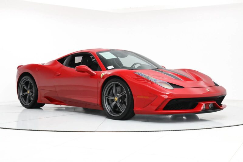 A striking red Ferrari with a sleek design, black wheels, and dual exhaust tips commands attention, reminiscent of the modern Ferraris' allure. Captured against a pristine white background, it evokes the spirit of the 458 Speciale.