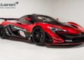 In a showroom adorned with McLaren Philadelphia signage, the red and black McLaren P1 GTR is on display, epitomizing the pinnacle of hypercars available for sale.