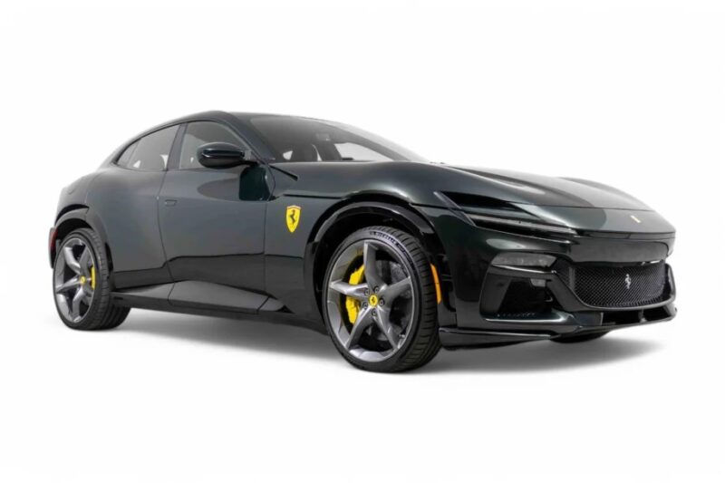 A sleek dark green Ferrari Purosangue SUV with yellow brake calipers and a prominent badge on the side, shot from a low angle.