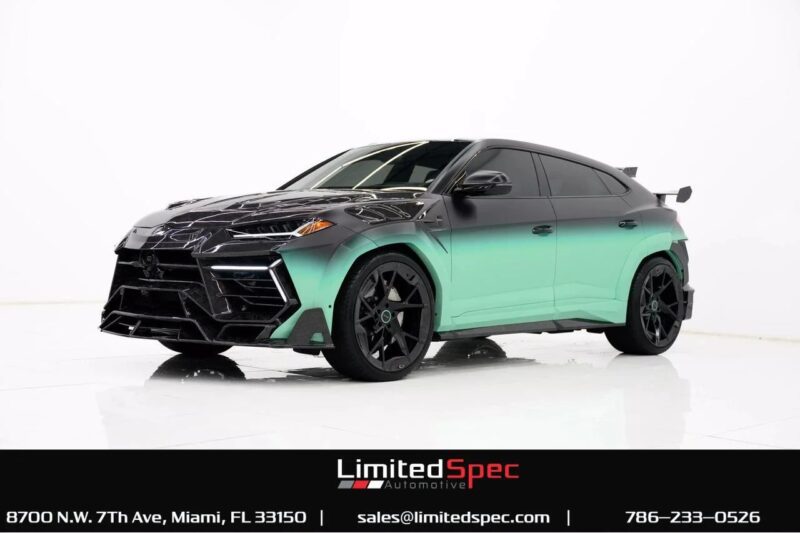 A matte black and green Lamborghini Urus, one of the best Lamborghinis among SUVs for sale, is displayed in a studio setting with Limited Spec Automotive contact details shown at the bottom.
