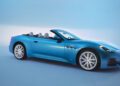 A striking blue Maserati GranCabrio sits in a studio setting with its top down, flaunting a sleek design and large white wheels. With 483HP ready to unleash, it captures the essence of luxury reminiscent of I.C.E. St. Moritz’s elegance and allure.