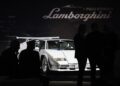 A white Lamborghini Countach takes center stage at the celebration, its sleek lines drawing admiration from silhouetted attendees. Nearby, Polo Storico experts discuss its pristine condition, adding to the event's allure.
