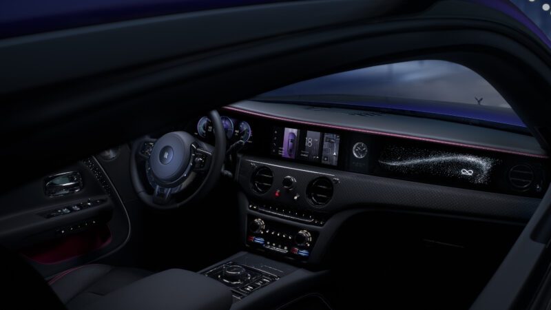 Luxury car interior at night, featuring a sleek dashboard with illuminated digital displays, intricate control panels, and ambient lighting accents.