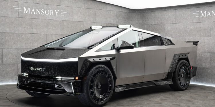 The Custom Tesla Cybertruck, with its futuristic silver and black angular design and subtle elongation, is prominently showcased in a showroom adorned with "Mansory" branding on the walls.