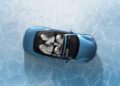 Top view of a Maserati GranCabrio with four white seats, parked on a light blue surface that evokes the icy elegance of I.C.E. St. Moritz.