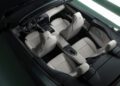 Top-down view of a Maserati GranCabrio interior featuring four white leather seats, a central console, and a sleek dashboard with digital displays, echoing the elegance of I.C.E. St. Moritz.