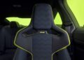 Black car interior with a sports seat, featuring "VR46" embroidered on the headrest, a nod to Valentino Rossi. Neon green accents on the seat and lime green window tint highlight the sleek design of this BMW M4 CS.