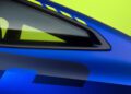 A close-up of a blue BMW M4 CS VR46 sports car window reveals a smooth gradient along the side panel, set against a vibrant lime green background—a nod to Valentino Rossi's iconic 46th birthday.