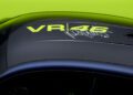 Close-up of a BMW M4 CS roof showcasing "VR46" alongside Valentino Rossi's signature, all set against a striking black and yellow design.