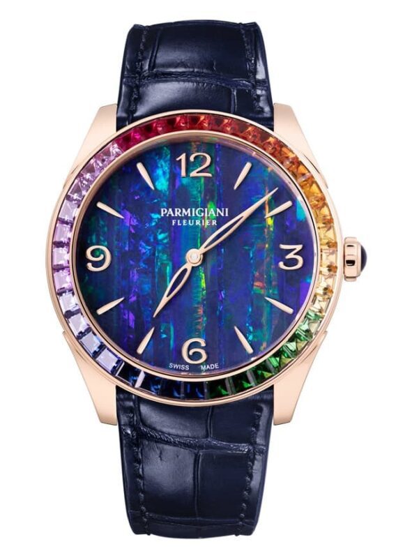 This exquisite luxury watch, among the best luxury watches, boasts a blue opal dial and a rainbow gemstone bezel. Finished with silver numbers and hands, its elegance is completed by a black leather strap and the distinguished "Parmigiani Fleurier" name on the dial.