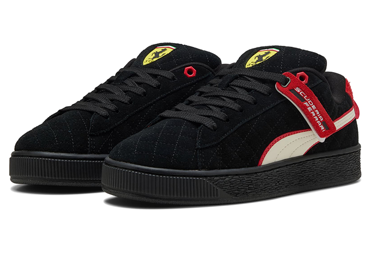 Black suede sneakers with red and white accents, featuring a Ferrari logo on the tongue and side tag, perfect for any wardrobe looking for a sporty edge.