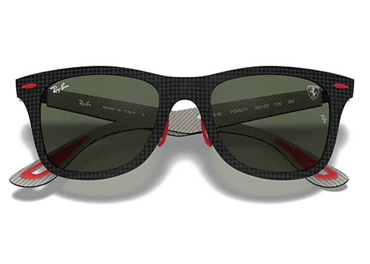 These Black Out sunglasses feature a striking checkered pattern in black and red, complemented by green lenses. With the Wheels x Wardrobe branding elegantly visible on the temples, they exude a bold style statement.