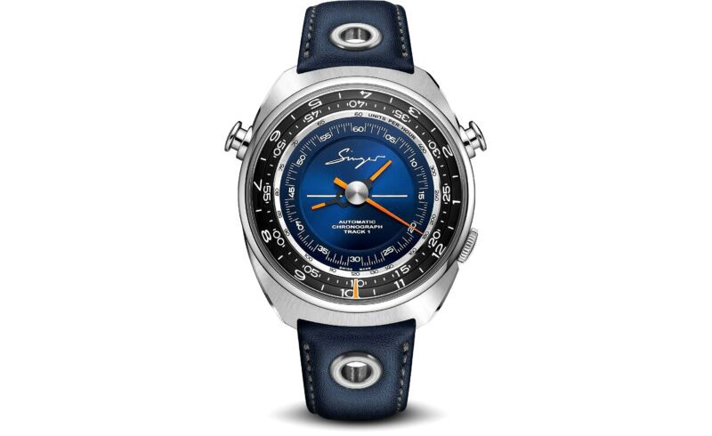 A silver wristwatch with a blue strap, ranked among the best luxury watches, features a multi-layered dial. The dial includes a central blue section with orange hands and outer rings displaying numerals.