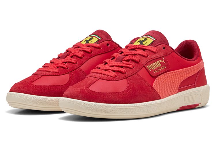 Pair of red PUMA sneakers with suede and leather panels, yellow Puma and Ferrari logos, beige rubber soles, and an automotive-inspired design perfect for the stylish driver.