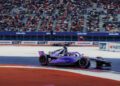 A Porsche Formula E race car speeds down the Miami track, its sleek purple body glistening under the sun as sponsor logos catch the eye. In the background, a massive crowd cheers with enthusiasm reminiscent of a Sergio Agüero-inspired frenzy.