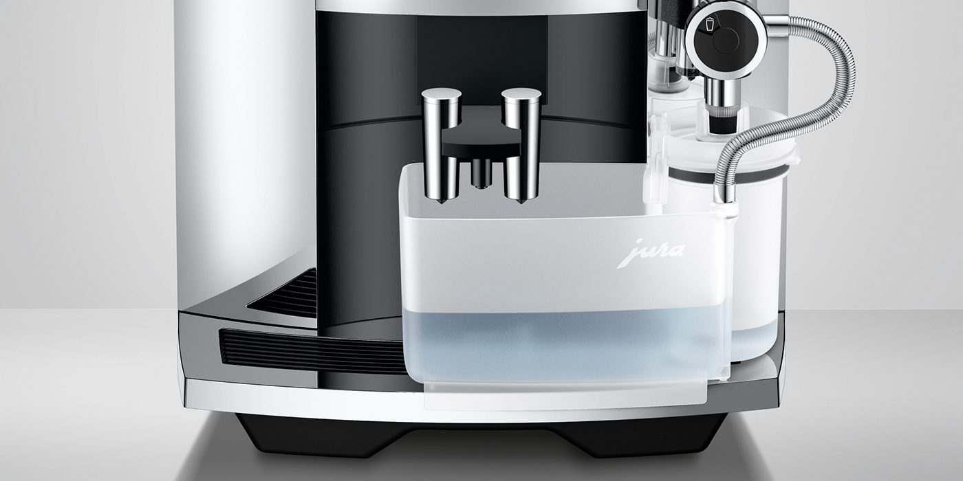 Close-up of the JURA S8 espresso machine, highlighting its sleek metallic finish and transparent water container—a perfect blend of innovation for ultimate coffee enjoyment.