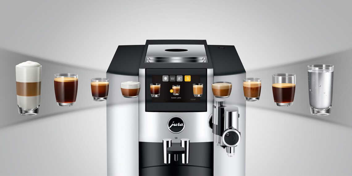 A JURA S8 coffee machine is shown with a digital display, surrounded by various coffee drinks, including espressos, cappuccinos, and a glass of water. Experience the innovation and coffee enjoyment that enhance every brew.