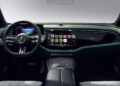 The futuristic Mercedes-Benz car interior boasts a digital dashboard, sleek steering wheel, and ambient lighting. The central touchscreen hosts an AI Radio App among other controls, all enveloped in modern design elements reminiscent of will.i.am's innovative style.