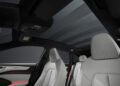 The interior of the Audi A6 Avant Wagon showcases a modern design, featuring a panoramic sunroof and light gray leather seats. With its hybrid capabilities, this vehicle seamlessly blends luxury and sustainability.