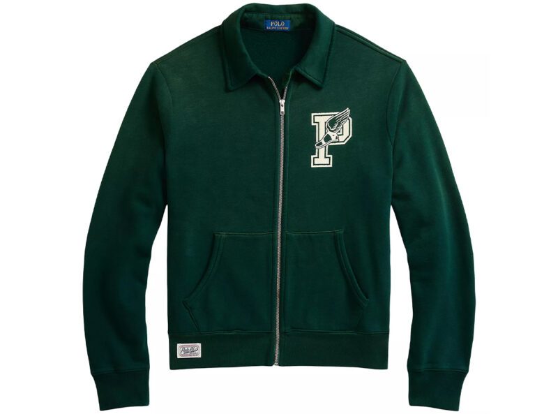 This St. Paddy's Day, embrace style and comfort with a green zip-up jacket featuring a collar, "P" and bird emblem on the chest, two front pockets, and a visible label at the back of the neck.