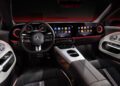 Step inside the cutting-edge interior of a Mercedes-Benz CLA, showcasing groundbreaking new tech with its digital dashboard and touchscreen. Luxurious black and white seats complement the ambient lighting, creating a sophisticated driving experience.