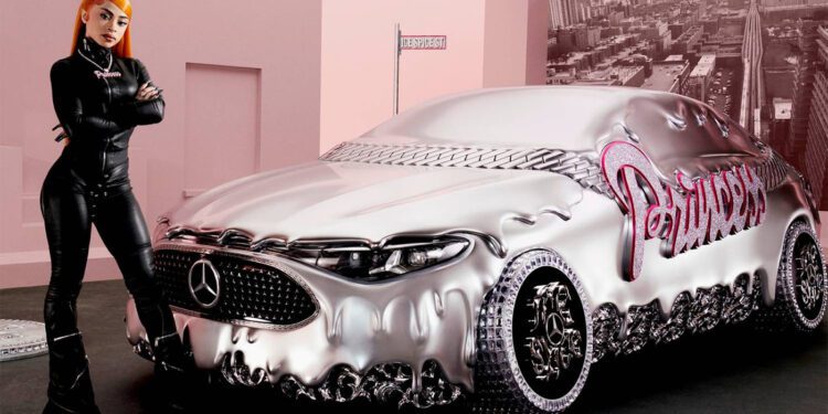 A woman in black leather stands beside a silver Mercedes-Benz CLA with "Princess" in pink on the side, set against a pink city-themed backdrop, channeling Ice Spice vibes for the ultimate remix of style and attitude.