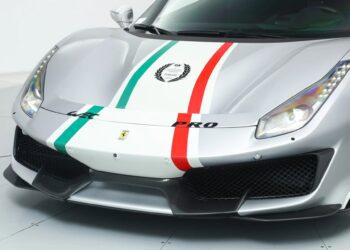 Front view of a track-ready Ferrari 488 Pistas for sale, finished in silver with green, white, and red racing stripes, showcasing the iconic Ferrari badge and a bold "PRO" label on the hood.