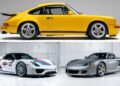 Side view of a yellow classic Porsche coupe above two modern Porsche sports cars, one with racing decals and the other in silver, parked indoors.