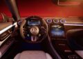 Step inside the CLE MANUFAKTUR Edition of this modern car, where a sleek dashboard with digital displays meets a steering wheel loaded with controls. The limited-edition interior dazzles with ambient lighting under a reddish glow, exuding Mercedes-AMG sophistication at its finest.
